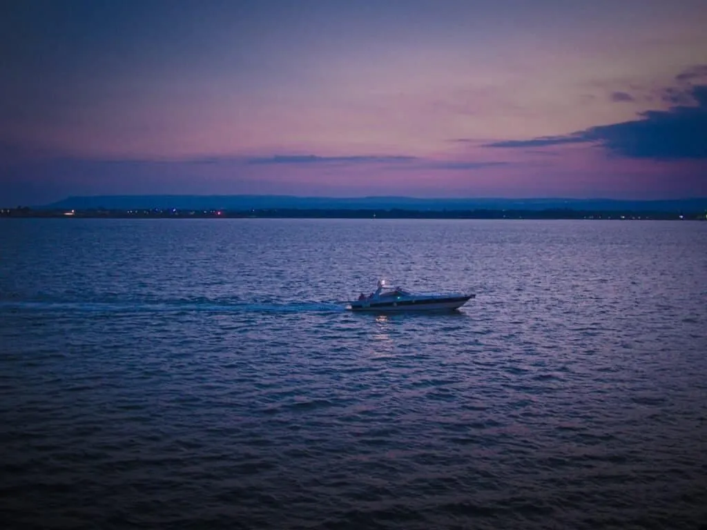 A lone boat off Ortygia at dusk