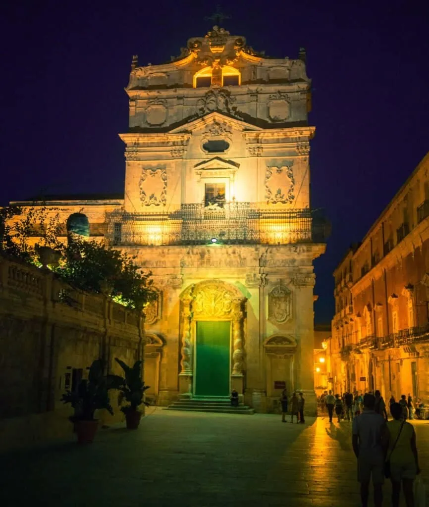 The Duomo facade floodlit at night