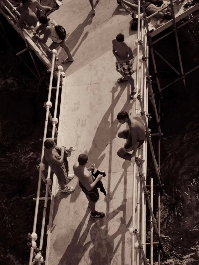 Sightseers on a scaffolded stair, shot from above