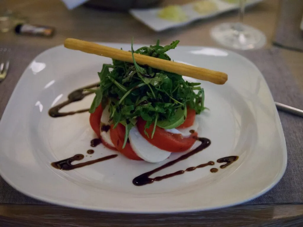 Caprese with rocket and a grissino at the Alasia