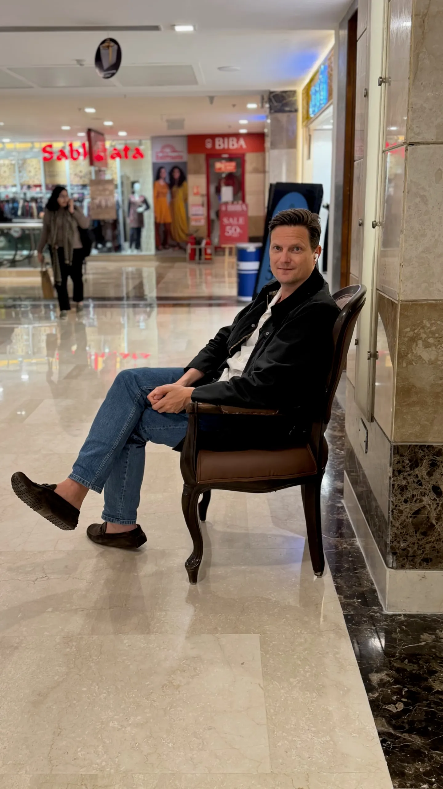 Husband chair outside BIBA store in Indian mall