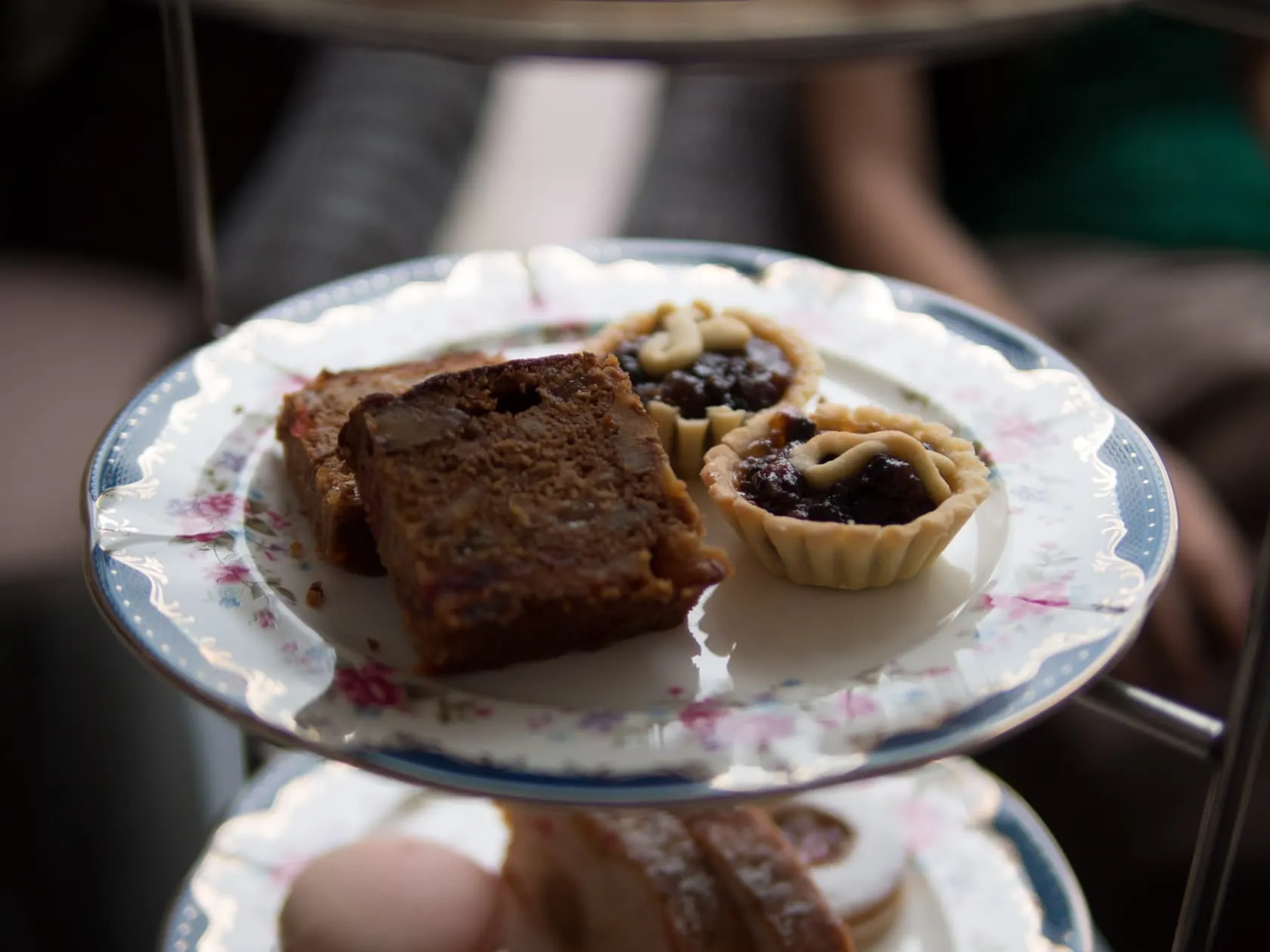 Fruit cake slices and mince tarts on floral china at Carcosa Seri Negara