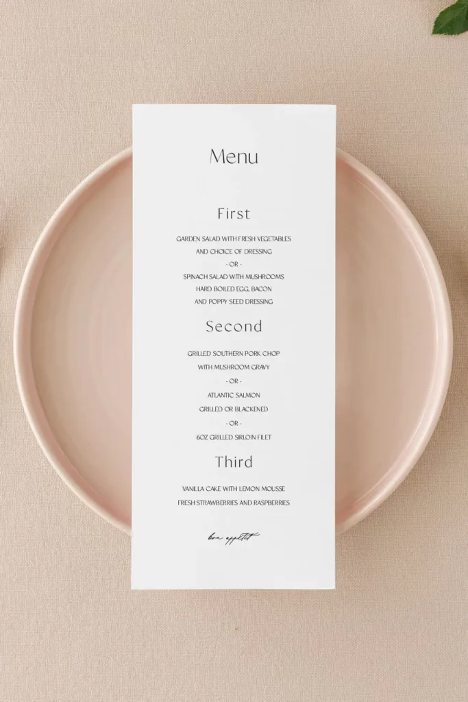 An elegant printed menu resting on a pale ceramic plate