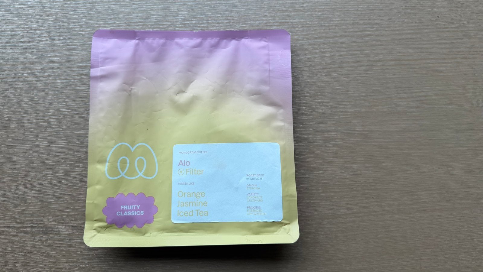 A tea bag featuring a blend of orange and jasmine for a refreshing fruit-infused tea experience.