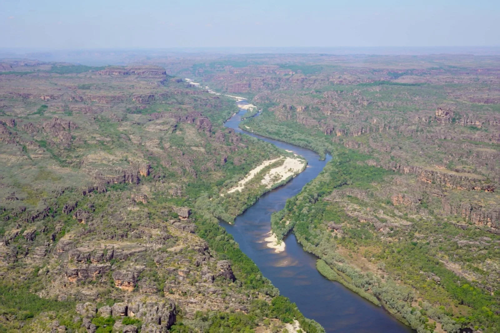 A broad river crossing Kakadu National Park, seen from the air.