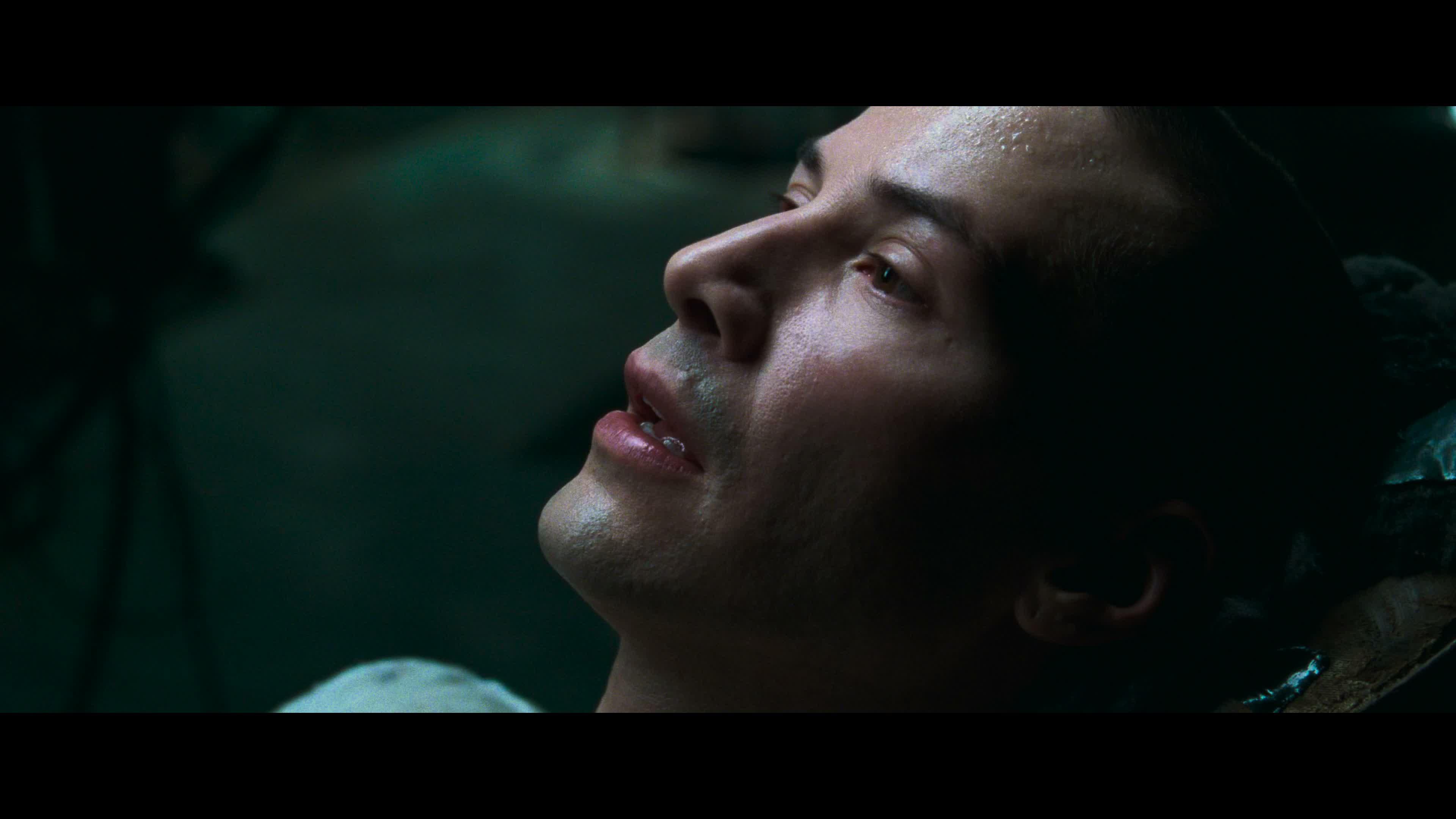 Neo opens his eyes after downloading martial arts skills in The Matrix.