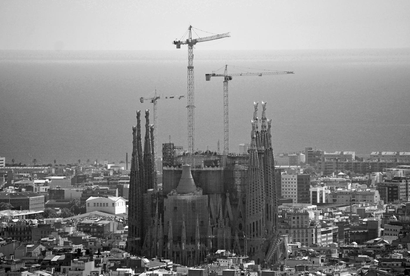 Sagrada Família surrounded by construction cranes